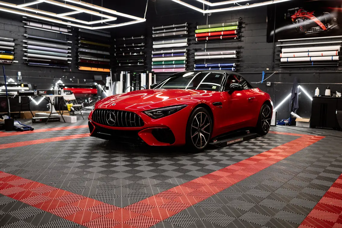 Red Mercedes-AMG SL55 roadster with full color paint protection film and tints.